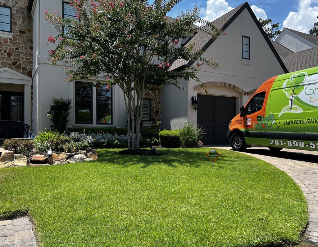 A pest control service van is parked outside a nice house with a well-maintained lawn in Taxes