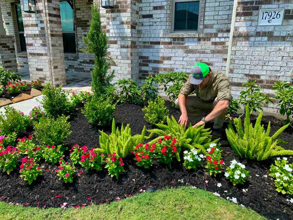 GreenGate Turf & Pest's employee provides the Flower Bed Maintenance service in Houston, TX